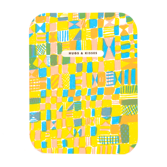 colorful abstract quilt pattern with an oval die-cut window that reveals text inside the card