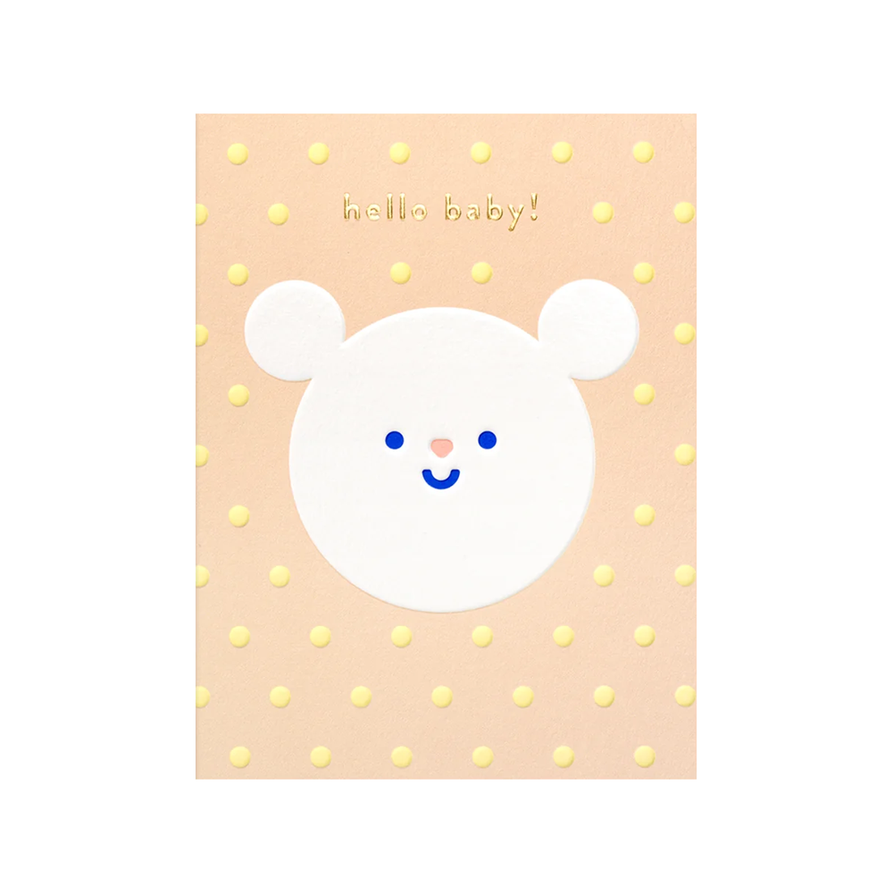 white circular bear with smiley face on peach background with yellow polka dots and "hello baby!" in gold text