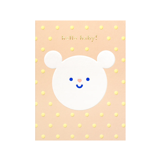 white circular bear with smiley face on peach background with yellow polka dots and "hello baby!" in gold text