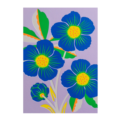 sprig of bright blue flowers with green, yellow, and orange accents on a lavender background