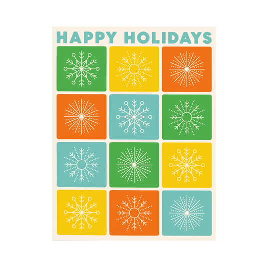 Greeting card saying Happy Holidays at the top in blue and 12 illustrations of snowflakes in different colors below it.