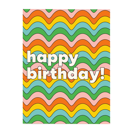 Greeting card with words "happy birthday!" written in white on top of illustrated wavy lines of different colors in the background.